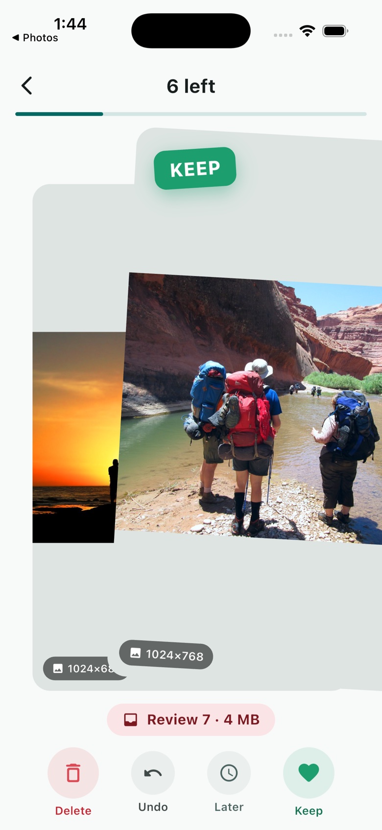 A card being dragged right in the Swippr deck, a green KEEP stamp above a photo of three hikers with backpacks by a canyon river